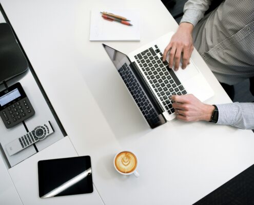 view-of-someones-desk-reviewing-business-insurance-and-product-liability